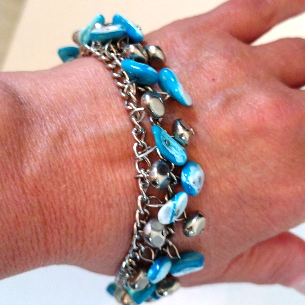 Beautiful double chains dangling shell and silver nuggets bracelet.